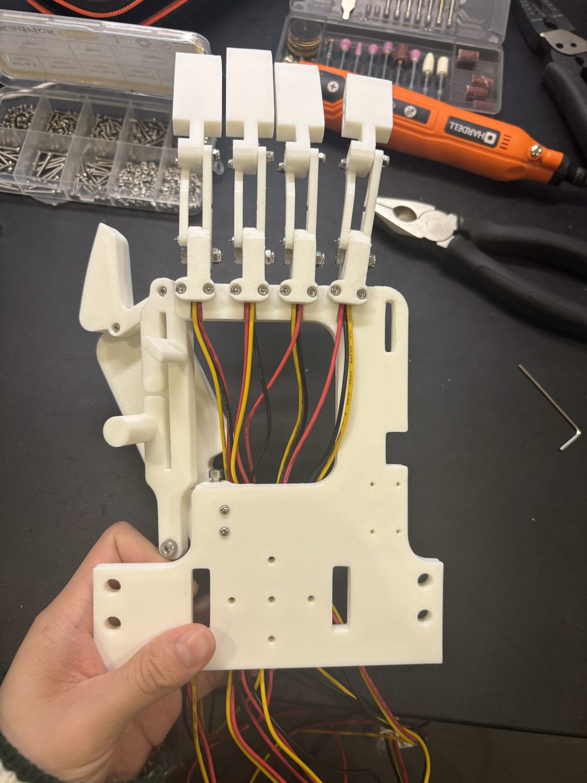 The first rigid Ripple exoskeleton with linked finger plates and encoder wiring