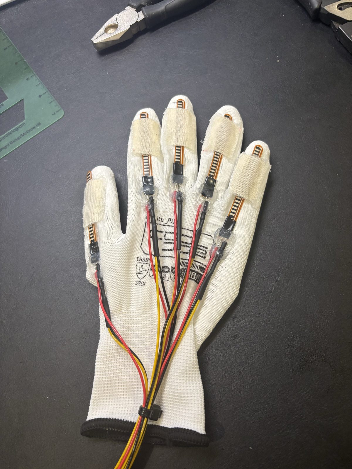 The fourth Ripple iteration: a fabric glove with one flex sensor along each finger